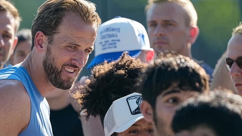 England’s Harry Kane, left, greets young fans in Kansas City, where England were given a warm welcome for their World Cup adventure.