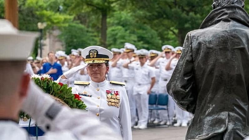 Rear Admiral Nancy Lacore salutes after placing a wreath at the statue of the Lone Sailor at the U. Navy Memorial in Washington DC on 3 June 2024.