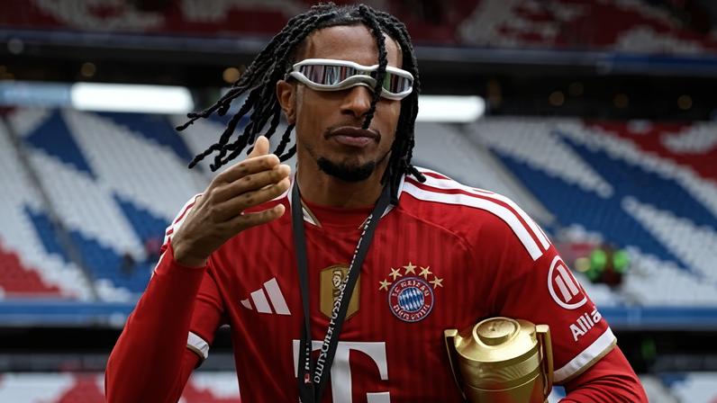 Bayern Munich’s Michael Olise celebrates with the Bundesliga player of the season award.