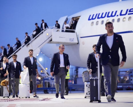 Iran players and coaching staff arrive at Tijuana airport on Sunday after flying in from Turkey.
