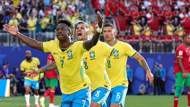 Vinícius Júnior and Bruno Guimaraes celebrate Brazil’s goal against Morocco.