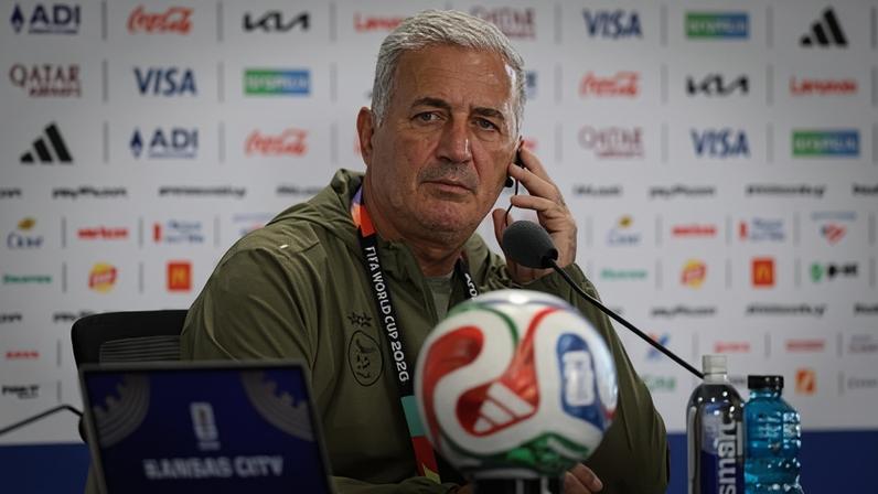 Algeria manager Vladimir Petkovic listens to the translator during a press conference ahead of his team’s match with Argentina.