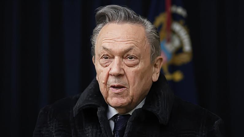 PA Media Former West Ham United chairman David Sullivan in the stands before the team's Premier League match at Molineux, Wolverhampton. He is wearing a black coat and tie with a white shirt.
