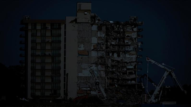 Coast Guard boats patrol in front of the partially collapsed Champlain Towers South condo building on 1 July 2021, in Surfside, Florida.