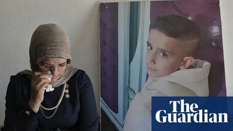 Aliyah al-Halaq beside an image of her late nine-year-old son Muhammad, killed by the Israeli army last October in the West Bank village of ar-Rihiya.