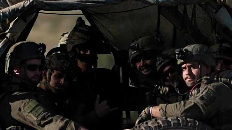 Israeli troops in a military vehicle patrol an area along Israel's northern border with Lebanon last week after an incident.