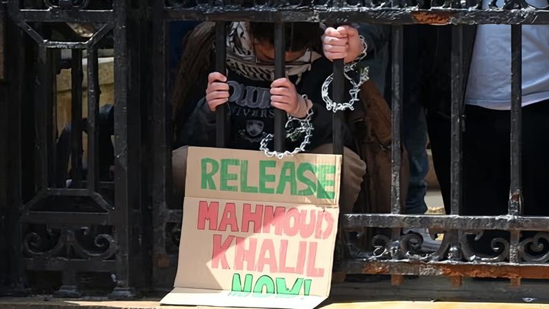 Supporters of Palestinian activist Mahmoud Khalil chain themselves to a fence at Columbia University, New York, 2 April 2025.