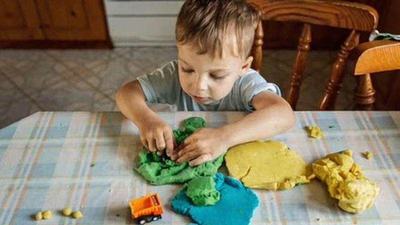 ‘Just have fun making things’ … a boy plays with modelling clay.