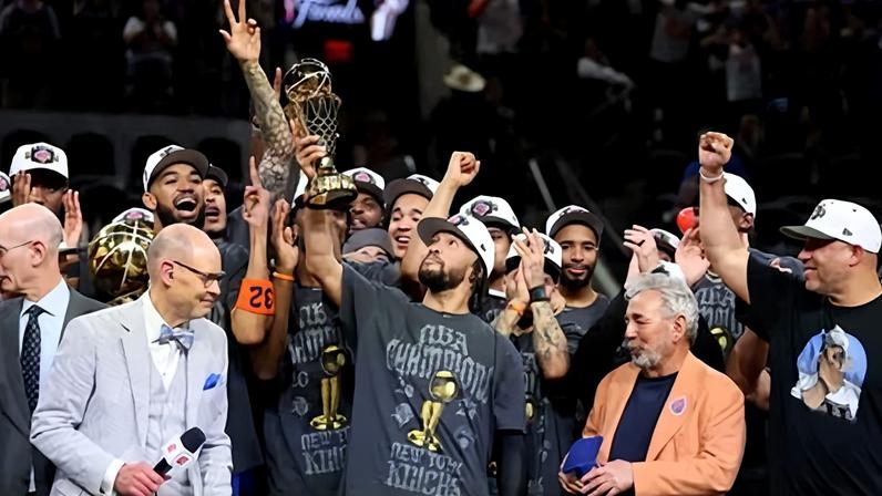Jalen Brunson lifts the NBA finals MVP trophy after the Knicks defeated the Spurs on Saturday to clinch their first title in 53 years.