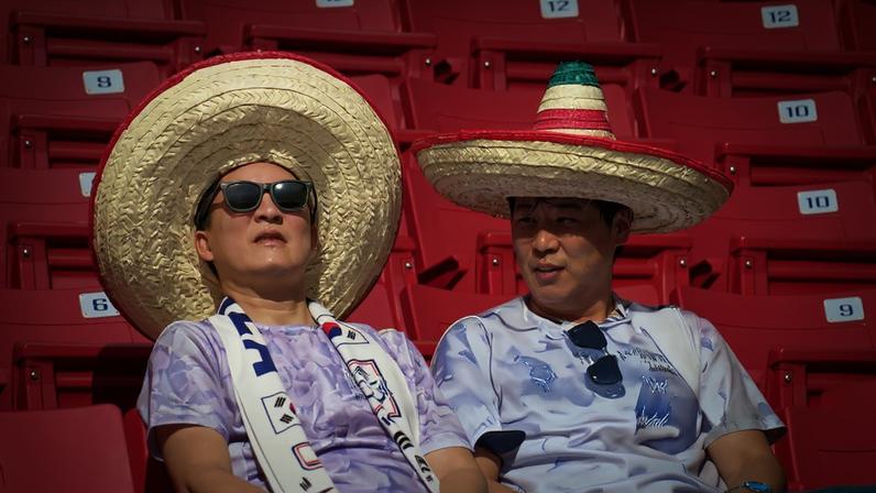 South Korea fans enjoy the sun in the stadium as they await kick off against Czechia in Group A.