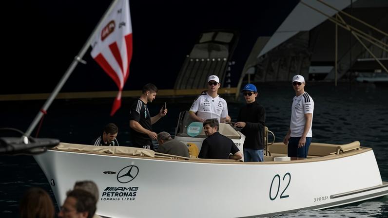 World championship leader Kimi Antonelli arrives by boat for the Monaco Grand Prix.