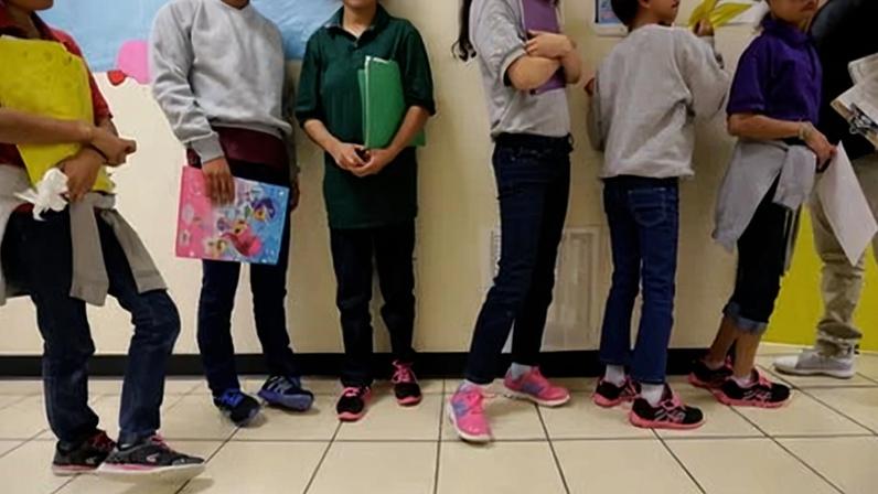 Migrant teens line up for a class at a ‘tender-age’ facility for babies, children and teens, in San Benito, Texas, on 29 August 2019.