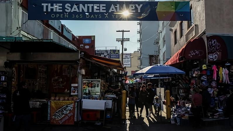 The famous Santee Alley in Los Angeles’s fashion district. The district’s business leaders hope the Games can bring a life-saving shock to the area.