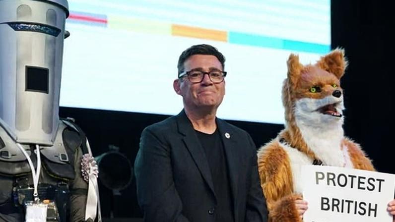 Count Binface, Andy Burnham and a man in a fox costume with a sign that says: 'Protect British wildlife'