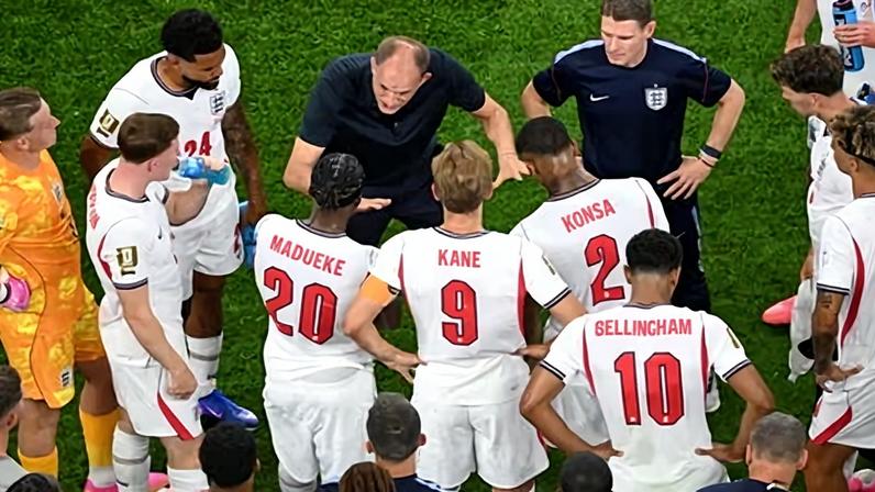Thomas Tuchel speaks to his players during the World Cup match between England and Croatia.