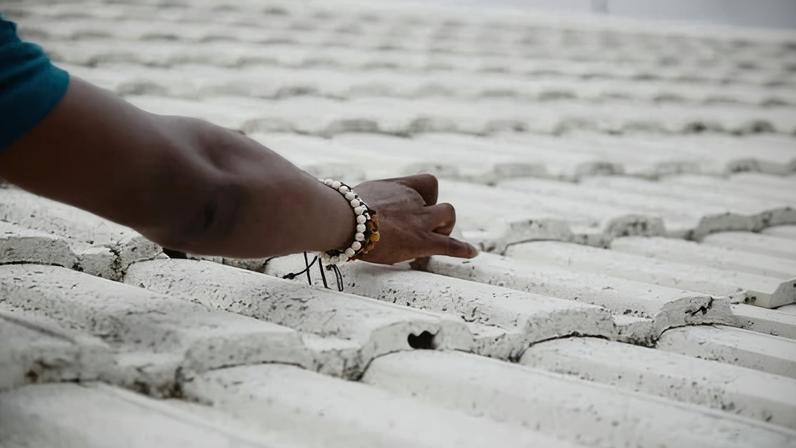 The researchers are collecting data from monitors inside houses as well as conducting health tests on participants to determine whether reflective white paint is effective at reducing temperatures inside homes