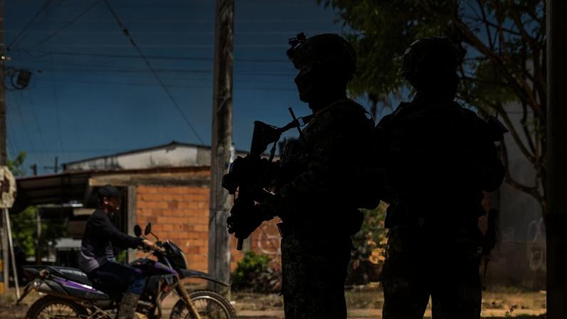 The Colombian army patrols the village of Calamar the day before the first round presidential election. The same weekend, two guerrilla groups fought in Guaviare, resulting in the deaths of 48 fighters.