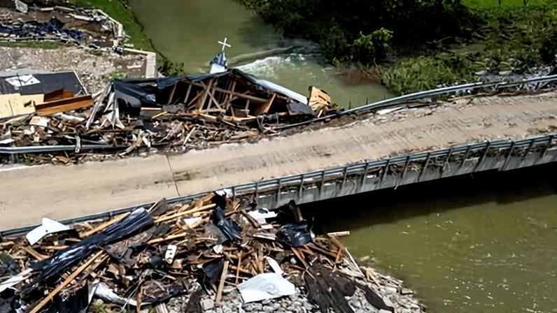 The destroyed Million Bible Church sits partially on a bridge on 28 June 2026 in Richmond, Kentucky.