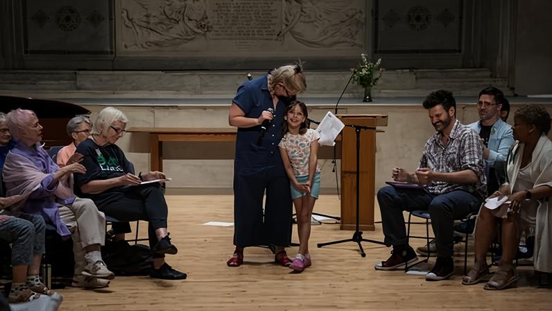 Nova, seven, and her mother, Elizabeth Hamby, lead an activity at the Judson Memorial Church in New York City on 14 June 2026.