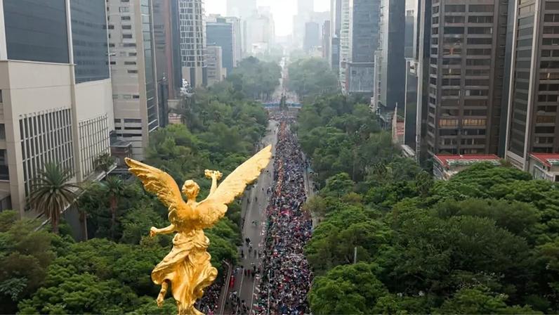 Thousands of people lined a major street in Mexico City on Saturday