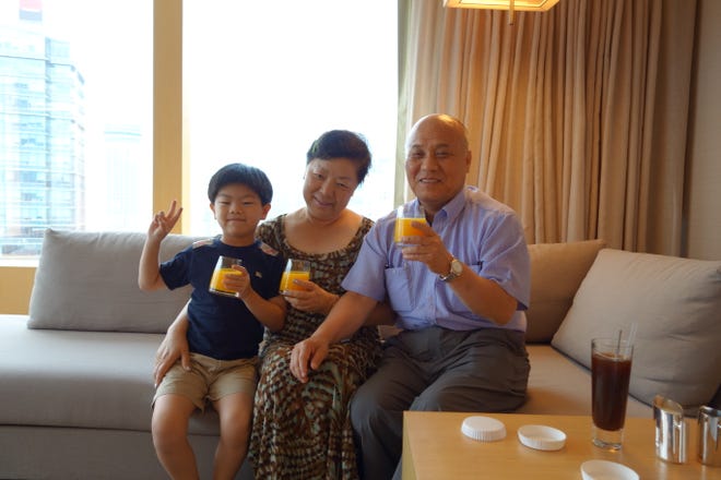 Jay Jung with his grandparents when he was little.