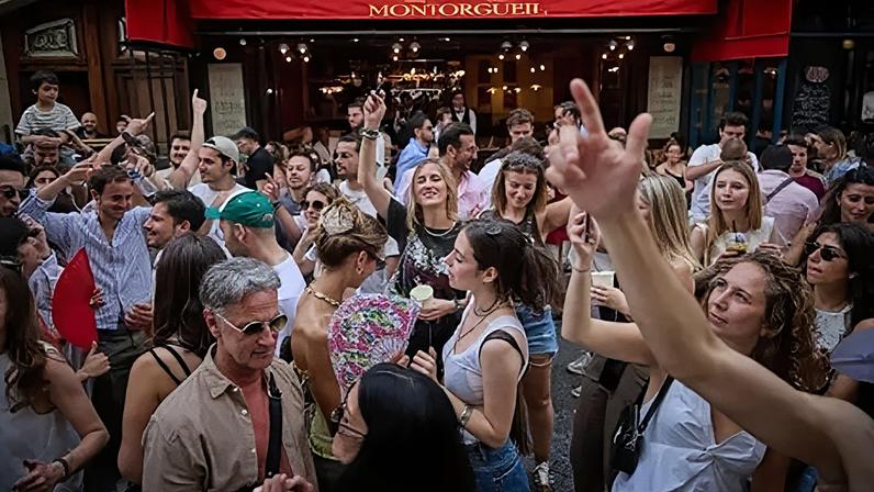 Revellers dance in the street during Fete De La Musique 2025 as bands and DJs play on streets across the French capital.