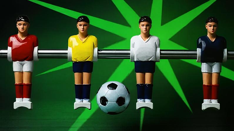 BBC Four table football figures lined up on a rod with a football in the middle over an electric green background.