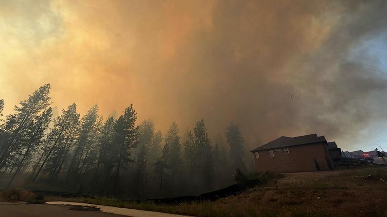This photo provided by Spokane Fire District 9 shows the Upriver Fire burning northeast of Spokane, Wash., on Tuesday, June 16, 2026. (Robert Gray/Spokane Fire District 9 via Associated Press.