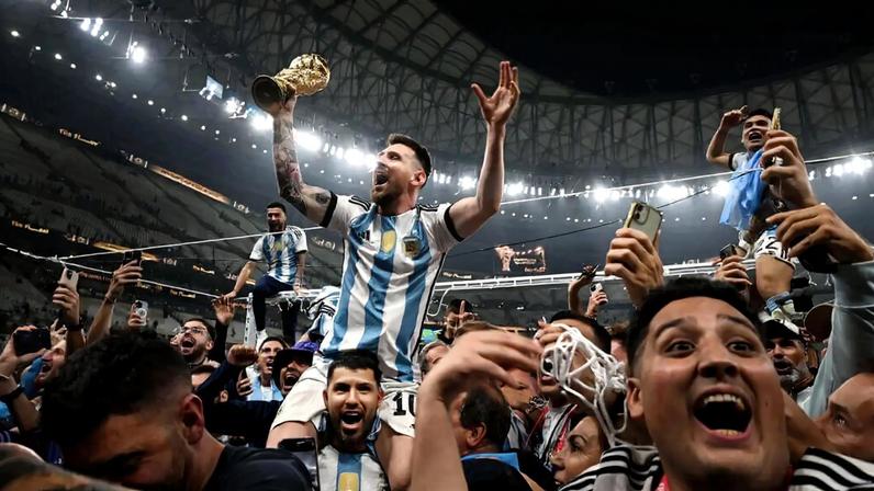 Messi celebrates with fans and team-mates after winning the 2022 World Cup