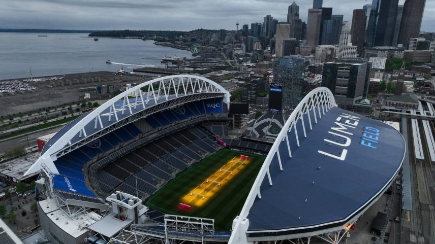 SEATTLE, WASHINGTON - MAY 06: Grass grows beneath lamps during an aerial view of Seattle Stadium on May 6, 2026 in Seattle, Washington. Seattle Stadium, officially named Lumen Field, will host six matches during the 2026 FIFA World Cup. (Photo by Steph Chambers/Getty Images)