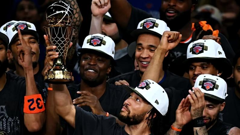 Jalen Brunson of the New York Knicks holds the NBA Finals MVP trophy during the ceremony after the closeout Game 5 between New York Knicks and San Antonio Spurs.