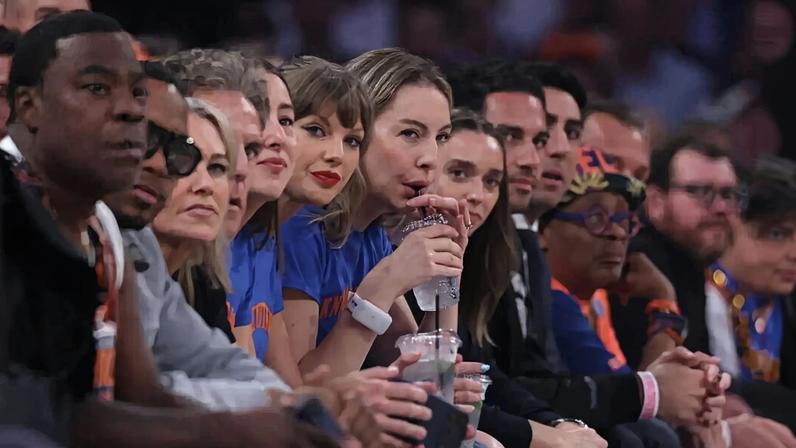 Taylor Swift (center) and Este Haim attend Game 4 of the NBA Finals between the San Antonio Spurs and the New York Knicks. Al Bello / Getty Images