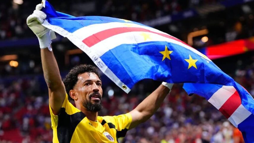 Vozinha celebrates with the Cape Verde flag