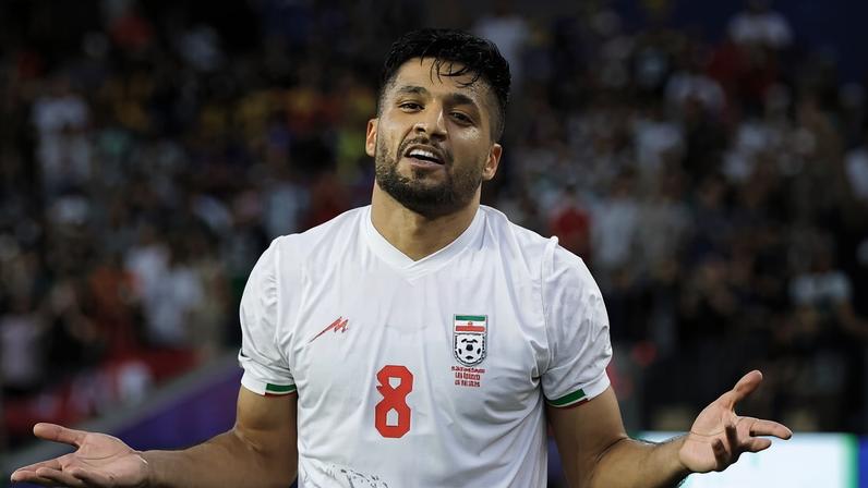 Mohammad Mohebi celebrates Iran's second goal