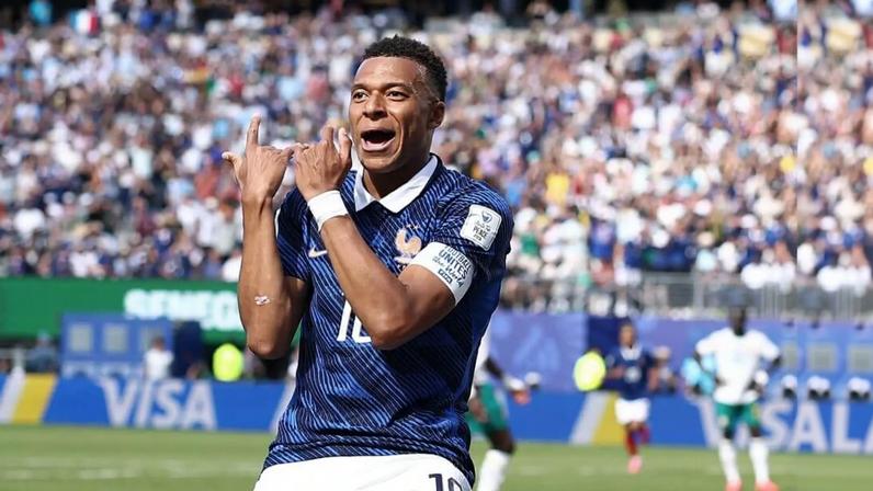 France's Kylian Mbappe celebrates scoring against Senegal