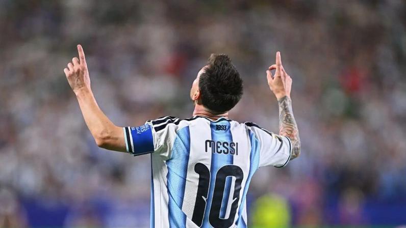 Lionel Messi celebrates scoring against Algeria
