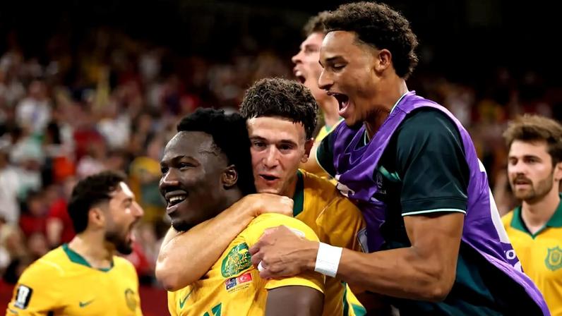 Nestory Irankunda is congratulated after scoring Australia's opening goal against Turkey