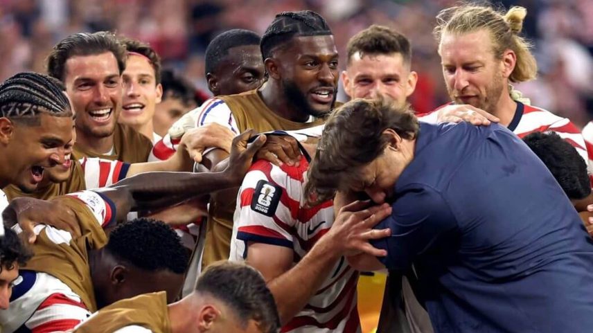 Mauricio Pochettino celebrates with his players after the United States beat Paraguay