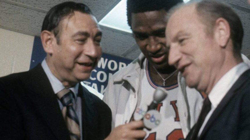 Knicks center Willis Reed and coach Red Holzman are interviewed in the locker room by Howard Cosell after the Knicks defeated the Lakers in Game 7 to win the 1970 NBA championship at Madison Square Garden.