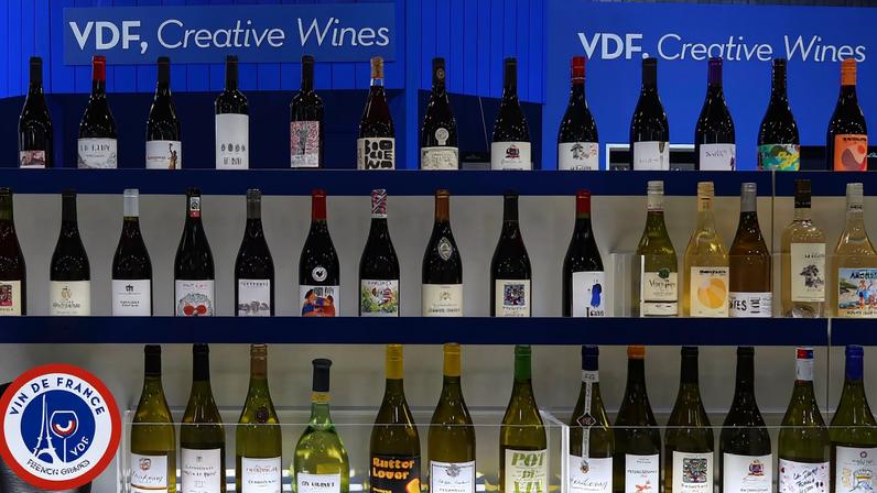 Rows of bottles of red and white wine, with 'VDF, Creative Wines' written above