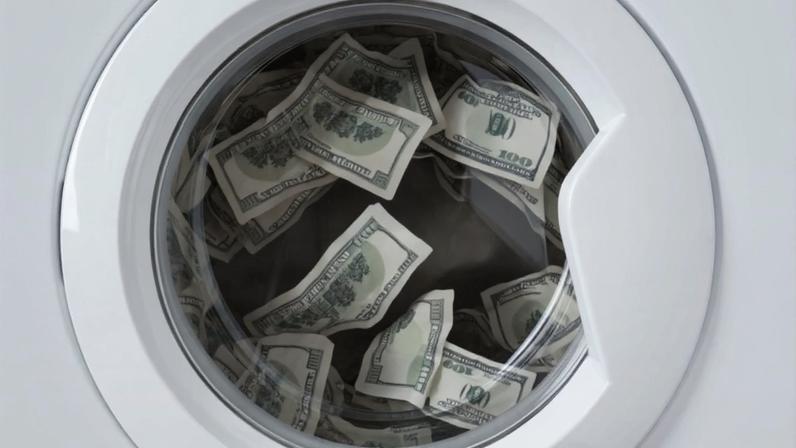 Lavadora cheia de dólares remete à crime de lavagem de dinheiro com criptomoedas