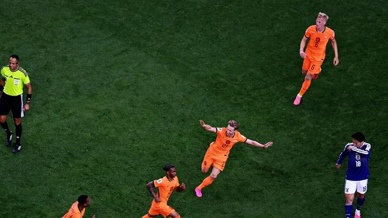 ARLINGTON, TEXAS - JUNE 14: Crysencio Summerville #24 of Netherlands celebrates scoring his team's second goal during the FIFA World Cup 2026 Group F match between Netherlands and Japan at Dallas Stadium on June 14, 2026 in Arlington, Texas. Stacy Revere/Getty Images/AFP