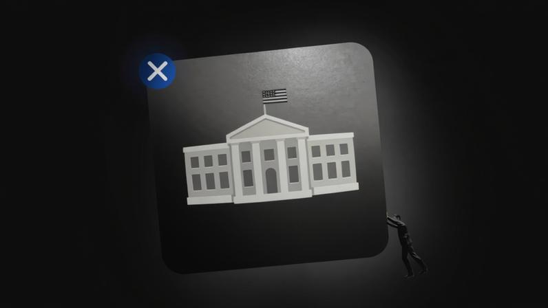 A man pushing a huge app with the white house logo on top