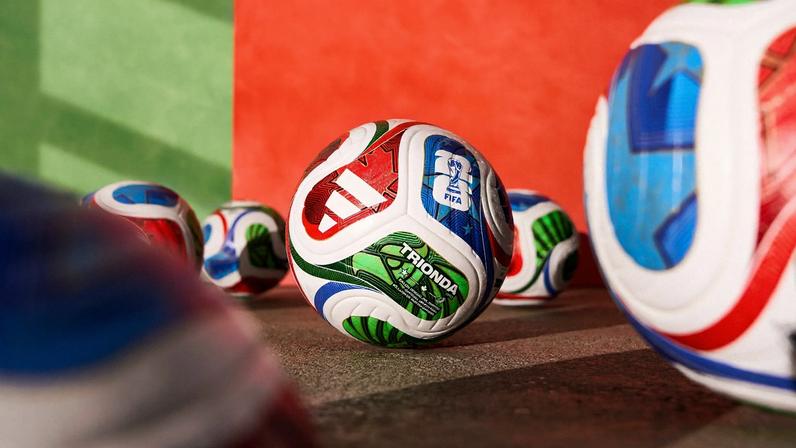 Image may contain Ball Football Soccer Soccer Ball Sport Rugby Rugby Ball Child and Person