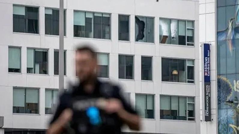 Police have not yet released a motive in the attack, in which one police officer and one bystander were killed.