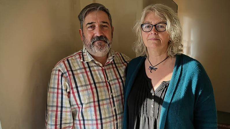 Tony and Becs Wadley in their Gower Peninsula home where they say badly installed internal wall insulation caused black mould.