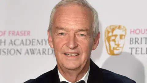 Getty Images Jon Snow in a black jacket and bow tie at the Bafta Awards