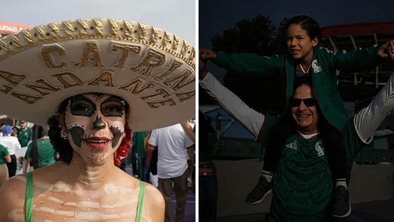 Two World Cup mascots breaking into an iron gate with a metal pole.