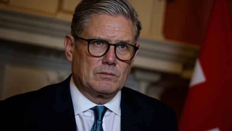 Getty Images Sir Keir Starmer looking pensive with out-of-focus Union Jack to his right