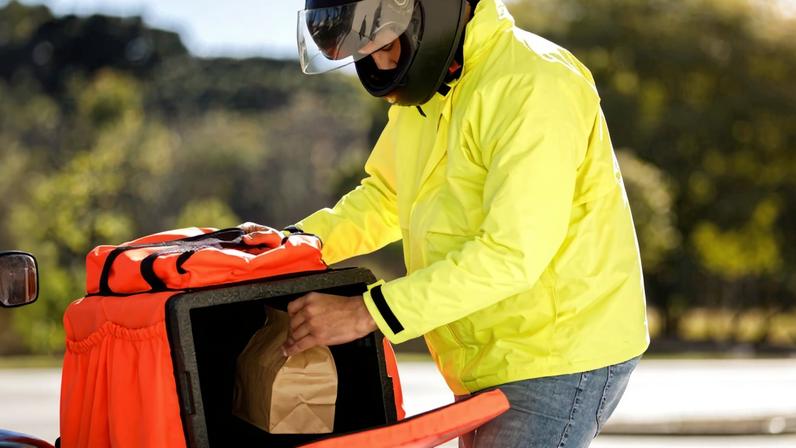 Delivery biker working.